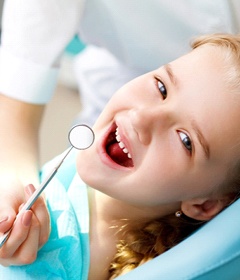 girl smiling dentist chair