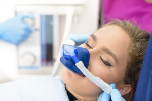 Woman getting nitrous oxide at dental office. 