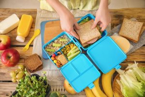 A healthy lunch being packed into a container