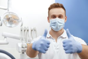 Dentist wearing personal protective equipment