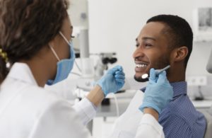 young man talking to his dentist in Freedom 