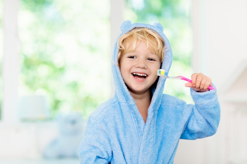 boy smiling brushing teeth in Freedom