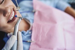 woman in dental chair with dentist 