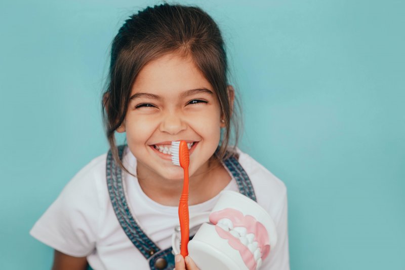 Portrait of a child brushing