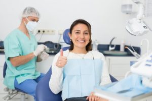 a patient visiting her dentist for her six-month checkup