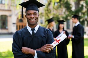 a college graduate smiling with healthy, beautiful teeth 